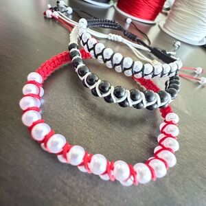 Handmade red bracelet with white beads